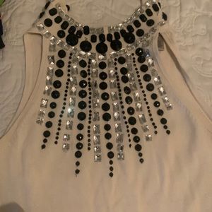 Blouse used it once or twice. Looks new. White or cream. Size Small